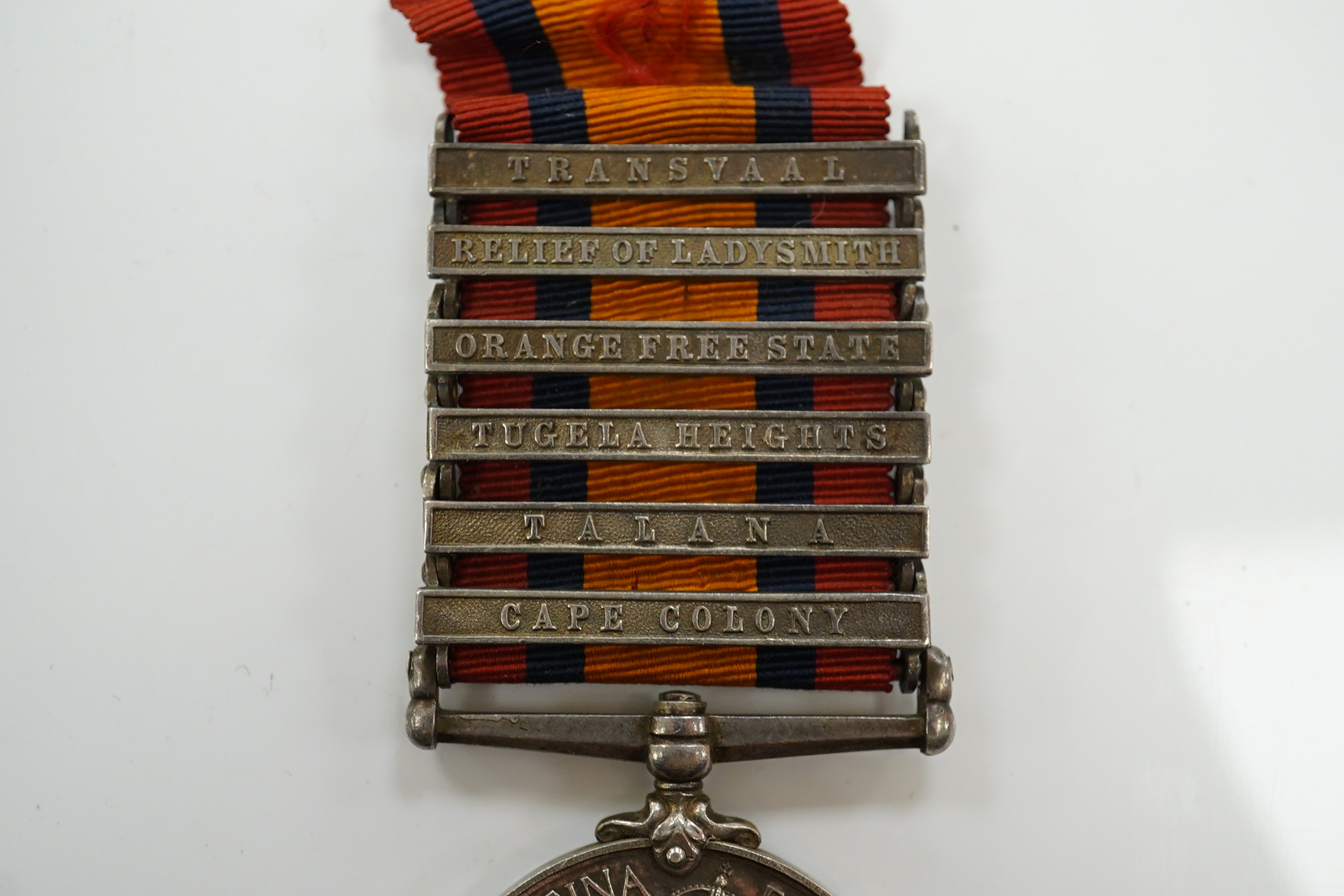 A Victorian South Africa medal awarded to CPL E. Daly RL. DUBLIN FUS. with six bars for Cape Colony, Talana, Tugela Heights, Orange Free State, Relief of Ladysmith and Transvaal. Condition - fair to good